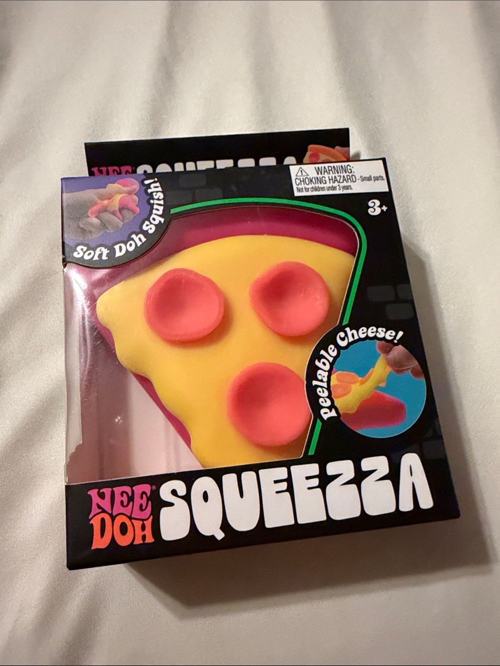 NeeDoh Squeezza Peelable Cheese Toy - Yellow & Pink